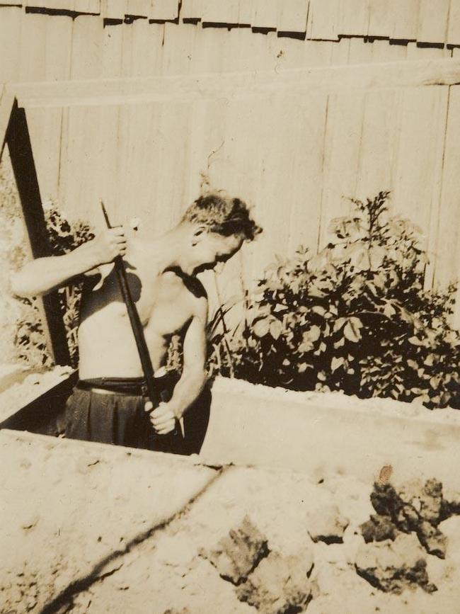 A man digging an air raid shelter in a backyard in Auburn, Victoria. Picture: Museum of Victoria.