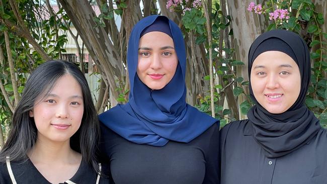 Pure Land Youth Peace Group TYPG executive (from left) Vice President Connie Qu, President Fatima Aria and secretary Fatemeh Hassani, Tuesday, February 8, 2022. Picture: Peter Hardwick