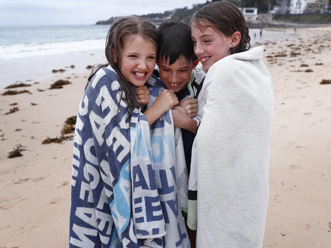 DAILY TELEGRAPH - 27.2.21Cloudy weather at Coogee beach today during a cold and miserable Sydney summer day. Local siblings (L to R) Ava, Max and Grace Dean (father Chris on 0422459593) pictured. Picture: Sam Ruttyn