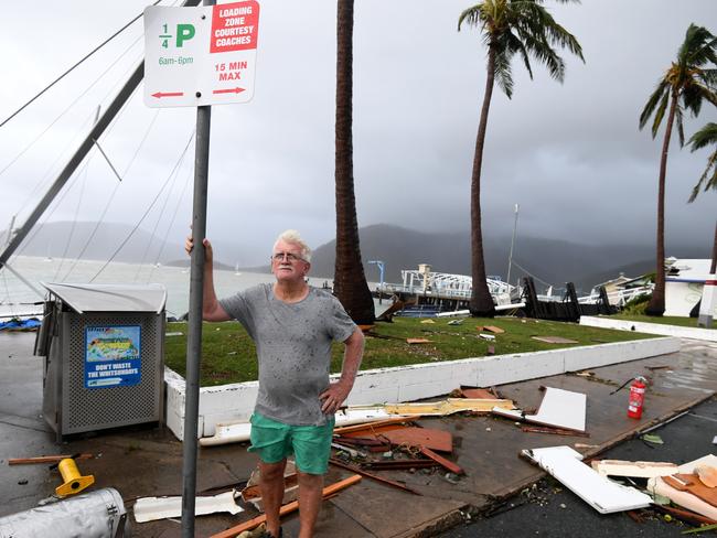 Local council worker Brian Doyle inspects damage at Shute Harbour, Airlie Beach, Wednesday, March 29, 2017. Cyclone Debbie has hit Queensland's far north coast yesterday as a category 4 cyclone, causing wide spread damage. Picture: AAP Image/Dan Peled