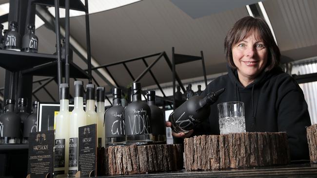 Diane Rae, of Grandvewe Cheeses at Brooke St Pier, pouring the award-winning Hartshorn vodka made by her son Ryan Hartshorn. Picture: LUKE BOWDEN