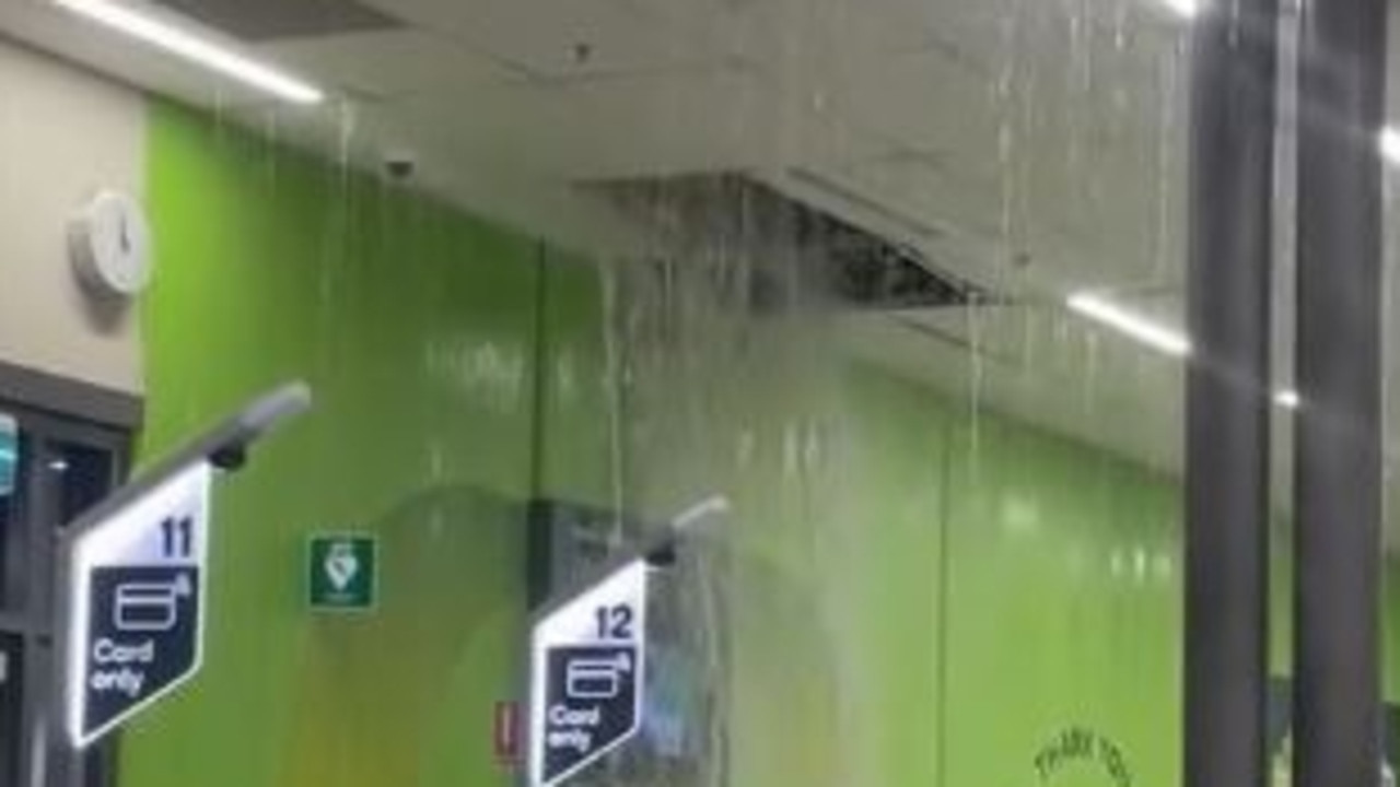 Water pouring in through the ceiling of a Morayfield Woolworths. Picture: Contributed