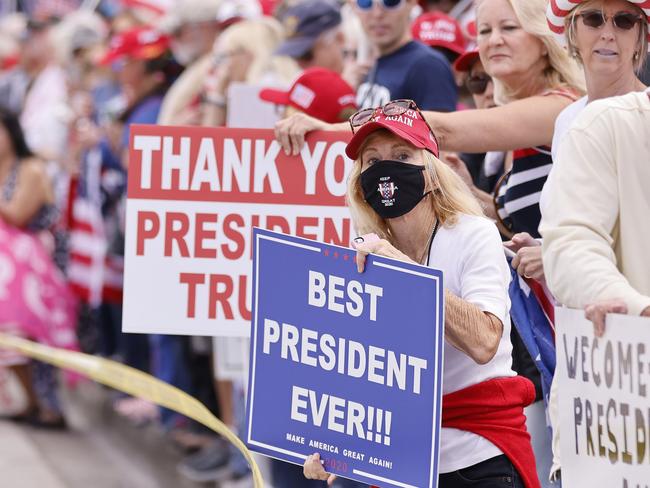 Supporters line the route of Donald Trump’s journey to his Mar-a-Lago estate in Florida yesterday. Picture: Getty Images