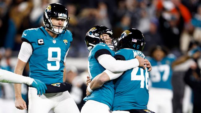 JACKSONVILLE, FLORIDA - JANUARY 14: Riley Patterson #10 of the Jacksonville Jaguars celebrates with teammates after kicking a field goal to defeat the Los Angeles Chargers 31-30 in the AFC Wild Card playoff game at TIAA Bank Field on January 14, 2023 in Jacksonville, Florida.   Douglas P. DeFelice/Getty Images/AFP (Photo by Douglas P. DeFelice / GETTY IMAGES NORTH AMERICA / Getty Images via AFP)