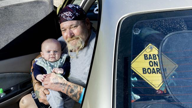 Craig Soden with four-month-old George is living out of his car in a Brisbane park, Thursday, August 18, 2022 – Picture: Richard Walker