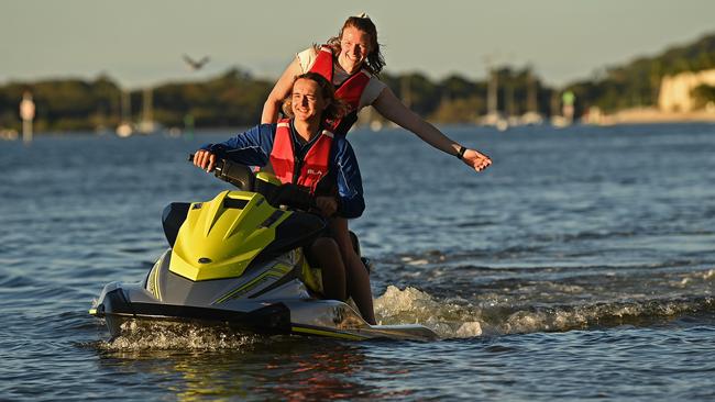 Instructor Hudson Mills from Noosa Jetski Hire with holiday-maker Charlotte Barry of Newcastle on the Noosa River on Thursday. Picture: Lyndon Mechielsen