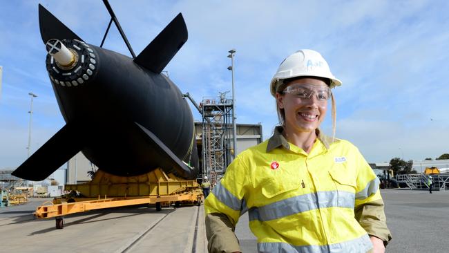 Ms Spence in 2015, pictured with the Collins Class submarine HMAS Farncomb, rolling out from maintenance. Picture: Tricia Watkinson.