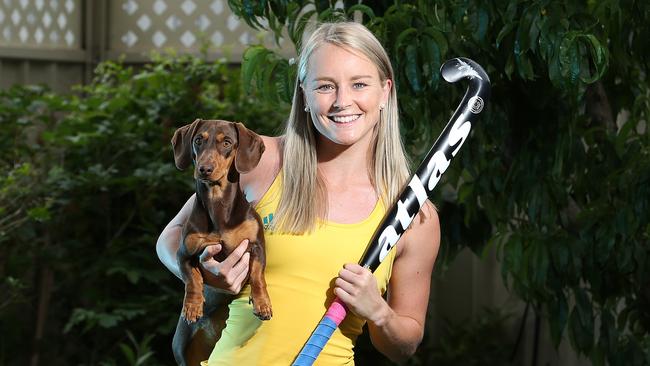 Hockeyroo Jane Claxton with her dog Hugo. Claxton works as an occupational therapist and says postponing the Olympics is the right thing to do Picture: Dylan Coker