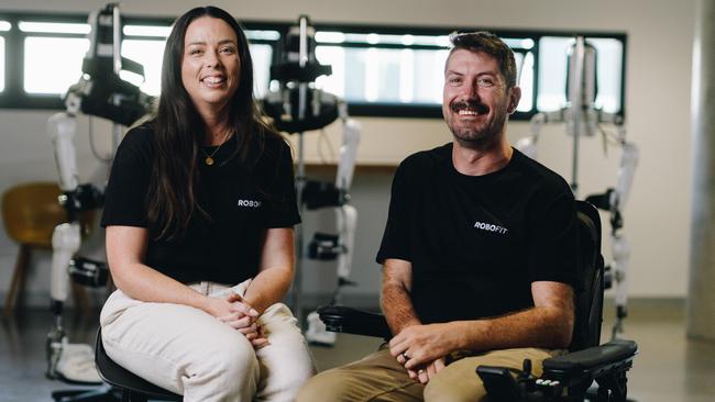 Daniel Hillyer, with his wife Maryanne Harris. Daniel became a quadriplegic after a balcony collapse in 2010 but has regained use of his hands and can now walk using a special frame. Picture: Supplied