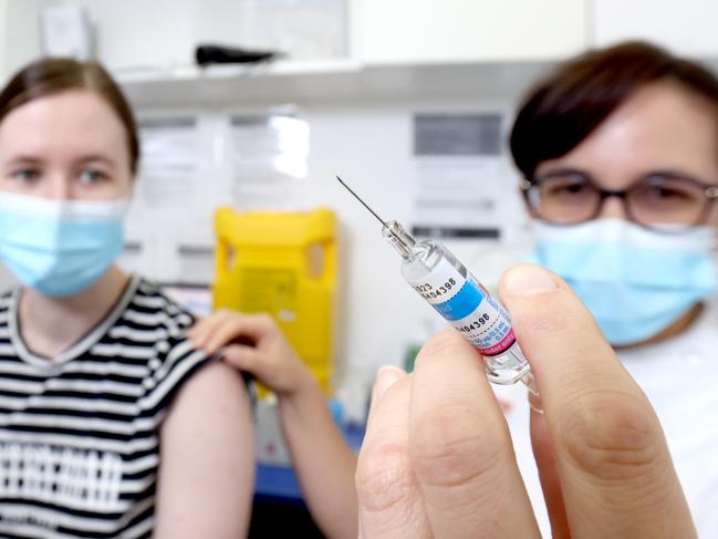 Courtney Mawn from Coorparoo getting their flu jab from Amanda Seeto Pharmacist, and Vice President, Pharmacy Guild of Australia, Qld, its the Afluria 2022 flu vaccine, Good Price Pharmacy Cannon Hill, on Monday 23rd May 2022 - Photo Steve Pohlner