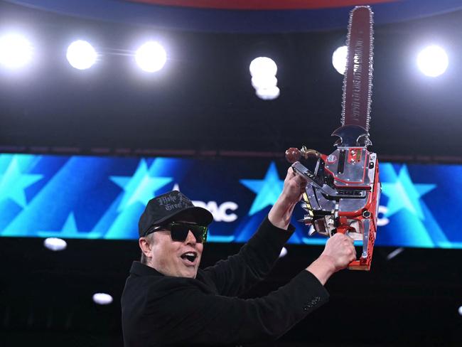 (FILES) Elon Musk holds a chainsaw during the annual Conservative Political Action Conference (CPAC) at the Gaylord National Resort & Convention Center at National Harbor in Oxon Hill, Maryland, on February 20, 2025. Musk's rise as President Donald Trump's all-powerful wingman was as rapid and unstoppable as one of his SpaceX rockets. But reports April 2, 2025 are fueling speculation that the billionaire's political career may be coming back to Earth. Politico and ABC News quoted unnamed sources saying Musk could step away from an unprecedented role in which he is spearheading brutal cuts to US government services and has emerged only second to Trump as the face of the administration. (Photo by SAUL LOEB / AFP)
