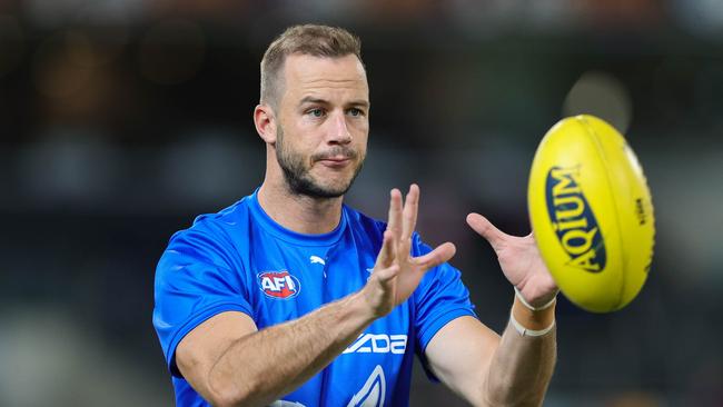 BRISBANE, AUSTRALIA – APRIL 02: Josh Walker of the Kangaroos warms up during the 2022 AFL Round 03 match between the Brisbane Lions and the North Melbourne Kangaroos at The Gabba on April 02, 2022 In Brisbane, Australia. (Photo by Russell Freeman/AFL Photos via Getty Images)