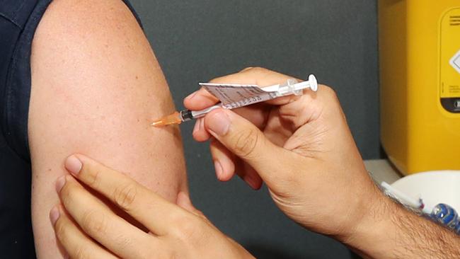 A nurse gets the Pfizer Vaccination at the Princess Alexandra Hospital. Picture: Tara Croser.