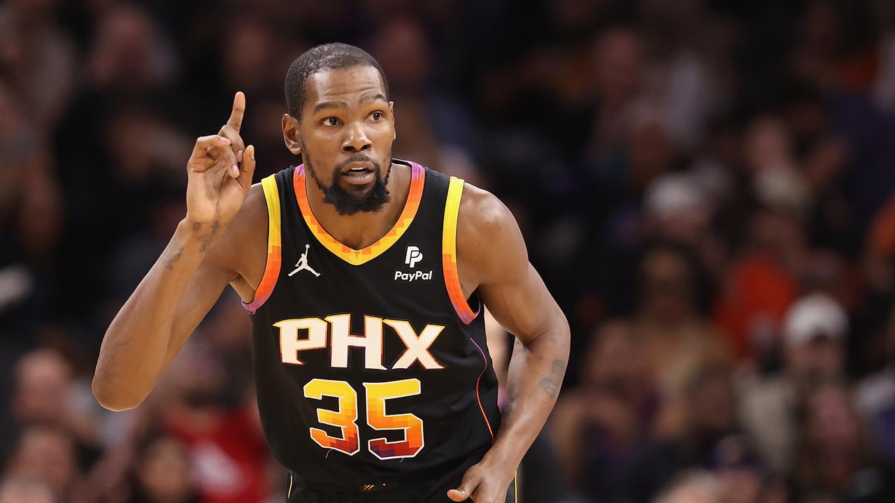 PHOENIX, ARIZONA - NOVEMBER 15: Kevin Durant #35 of the Phoenix Suns reacts to a three-point shot during the first half of the NBA game against the Minnesota Timberwolves at Footprint Center on November 15, 2023 in Phoenix, Arizona. NOTE TO USER: User expressly acknowledges and agrees that, by downloading and or using this photograph, User is consenting to the terms and conditions of the Getty Images License Agreement. (Photo by Christian Petersen/Getty Images)