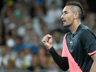 Nick Kyrgios celebrates his win against Viktor Troicki. Picture: JULIAN SMITH