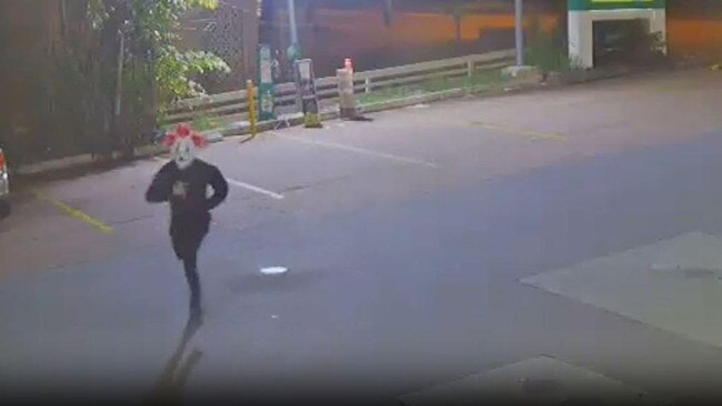 The man is first seen running towards the servo around 7.30pm on December 29. Picture: Supplied / QPS