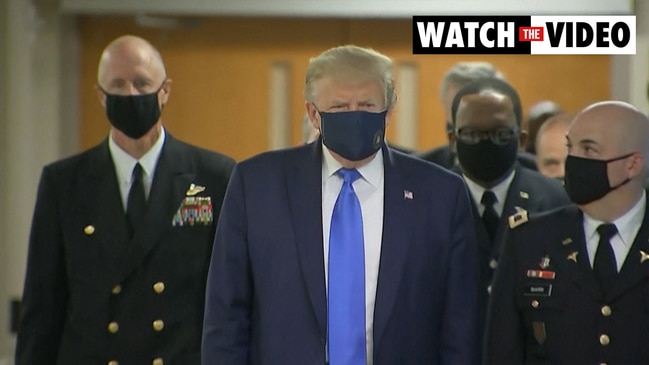 Trump appears in public with a face mask for the first time