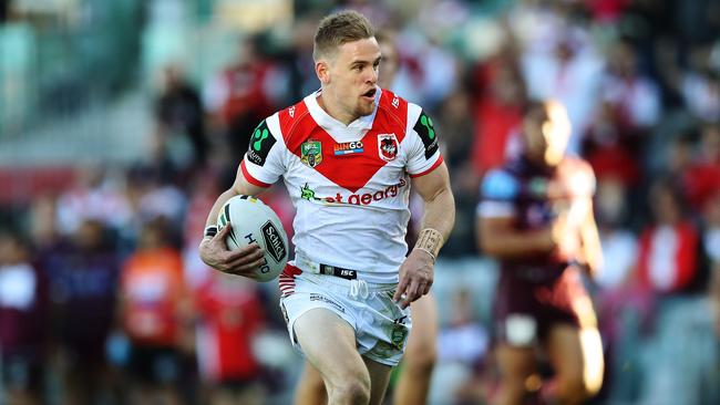 Matt Dufty sprints away to score a try on debut for the Dragons. Picture: Brett Costello