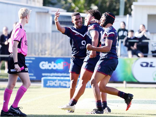 Ipswich SHS player Josiah Pahulu celebrates with teammates after a try. Picture: NIGEL HALLETT