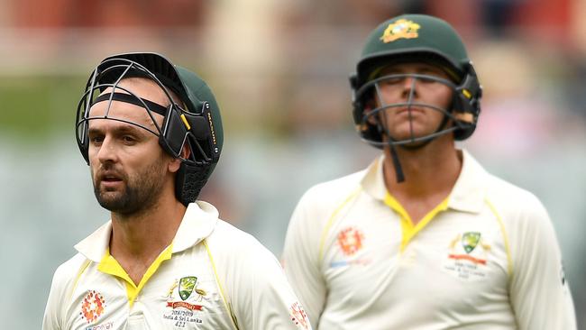 Nathan Lyon and Josh Hazlewood walk off the Adelaide Oval after the loss. Picture: Getty