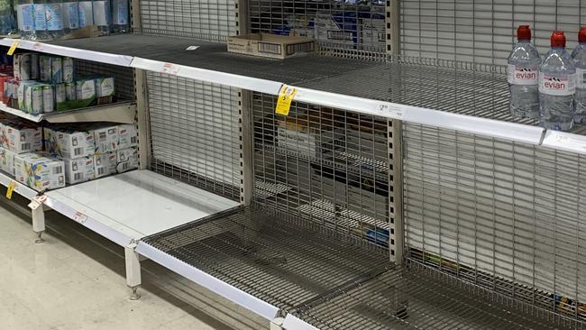 Shelves almost empty of water at Brandon Park Shopping Centre after potential contamination caused by power outages from wild weather in Melbourne. Picture: Suzan Delibasic