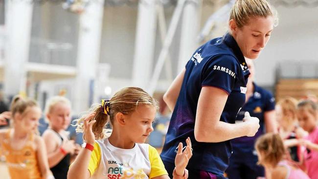 ON COURT: Jacqui Russell and Willow Perkins, 6, at a Lightning clinic at Caloundra. Picture: Patrick Woods