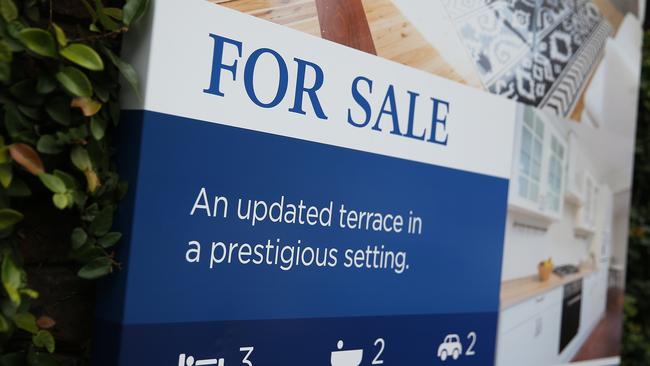 A "For Sale" sign is displayed outside a terrace house in the suburb of Woollahra in Sydney, Australia, on Thursday, June 18, 2015. Surging home prices in cities including Sydney are unlikely to be affected by the banking regulator's efforts to curb mortgage lending to investors, according to National Australia Bank Ltd. Photographer: Brendon Thorne/Bloomberg via Getty Images