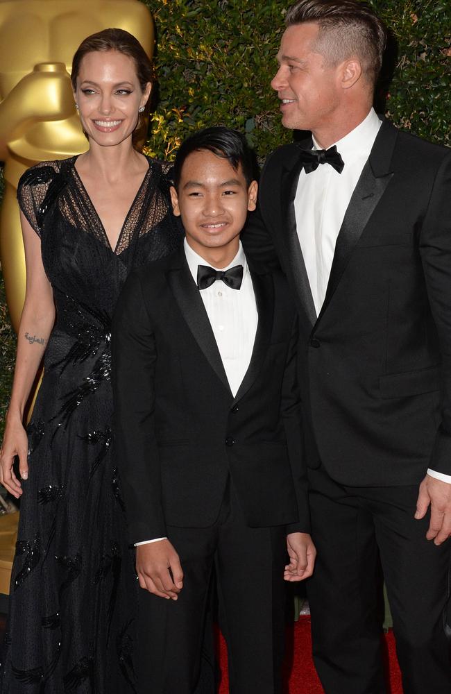 Angelina Jolie, Brad Pitt and their son Maddox at the 2013 Governors Awards. Picture: Robyn Beck.