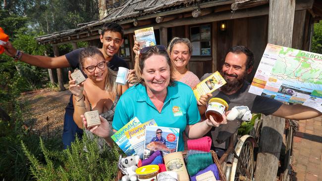 The Orbost Visitor Information Centre manager Melissa Dooley welcomes French tourists Araij, Mickael, Jade and Corentin. Picture: Alex Coppel