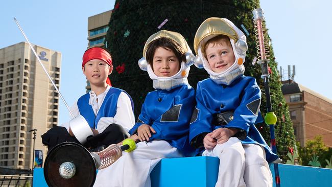 Jason Xiao, 8, Naoto Adams, 8, and Angus Richard, 6, ahead of the National Christmas Pageant. Picture: Matt Loxton