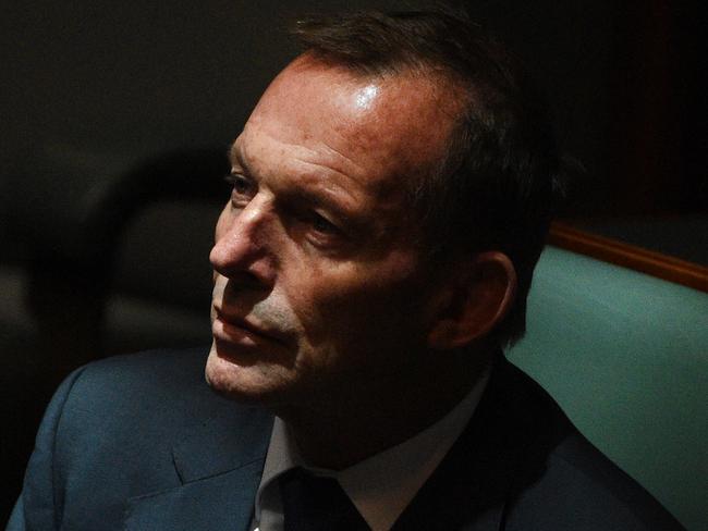 Former prime minister Tony Abbott looks on as Australian Prime Minister Malcolm Turnbull makes the Annual Infrastructure Statement in the House of Representatives at Parliament House in Canberra, Thursday, Nov. 24, 2016. (AAP Image/Mick Tsikas) NO ARCHIVING