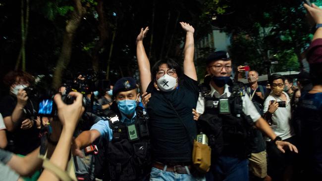 Yu Wai-pan from the League of Social Democrats is detained in the Causeway Bay district of Hong Kong on Saturday. Picture: AFP