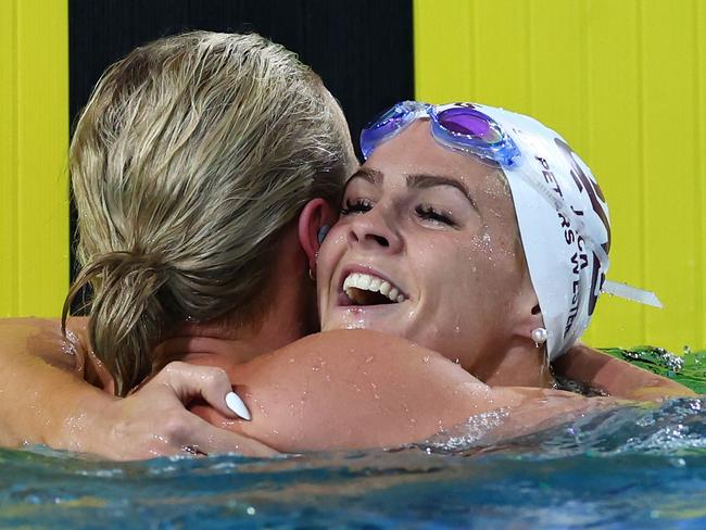 Ariarne Titmus is congratulated by Shayna Jack after the former broke the world record. Picture: Quinn Rooney/Getty Images