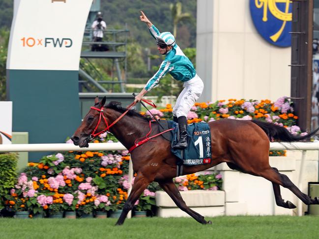 James McDonald celebrates his QEII Cup win aboard Romantic Warrior at Sha Tin. Picture: HKJC