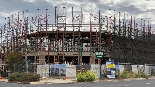 Scaffolding remains at the building site of the planned Emperor Living apartment complex in Mawson Lakes. Picture: Supplied