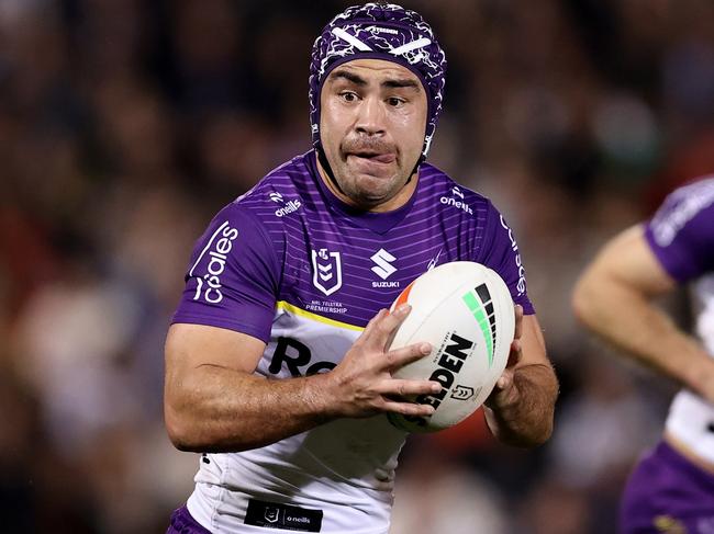 PENRITH, AUSTRALIA – AUGUST 15: Jahrome Hughes of the Storm runs the ball during the round 24 NRL match between Penrith Panthers and Melbourne Storm at BlueBet Stadium, on August 15, 2024, in Penrith, Australia. (Photo by Brendon Thorne/Getty Images)