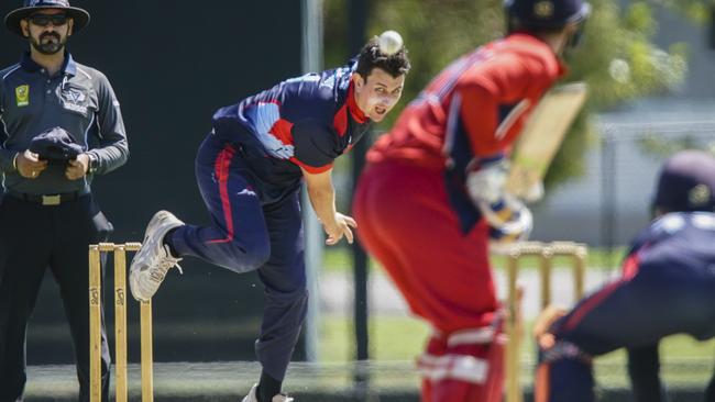 Peter Cassidy bends his back for Dandenong. Picture: Valeriu Campan