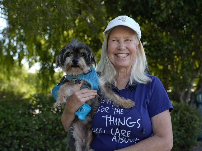 Kathy Wall with her dog Scruffy in Brisbane, California, earlier this year feared Mr Trump would stoke a civil war.