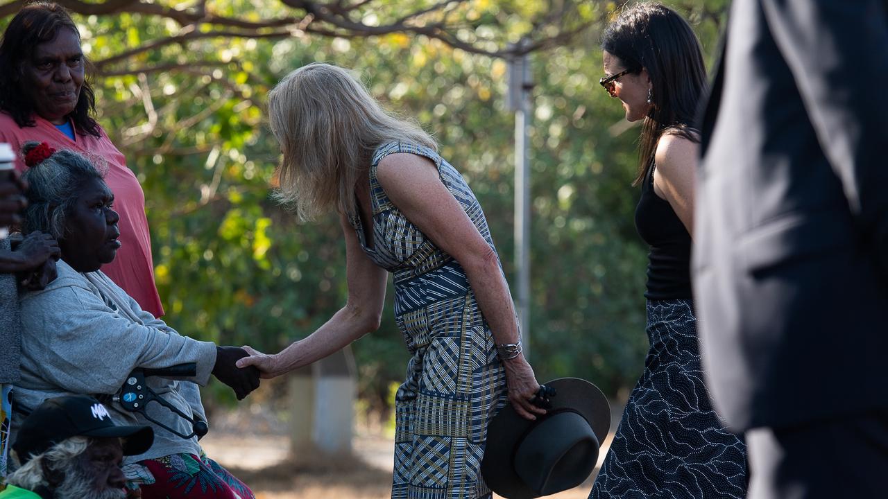 Coroner Elisabeth Armitage shakes hands with Ngeygo’s older sister Mary Malbiynga after her family invited the coronial inquest to take part in a ceremony at Mindil Beach, where on December 23 2019 her sister was killed by Garsek Nawirridj. Picture: Pema Tamang Pakhrin