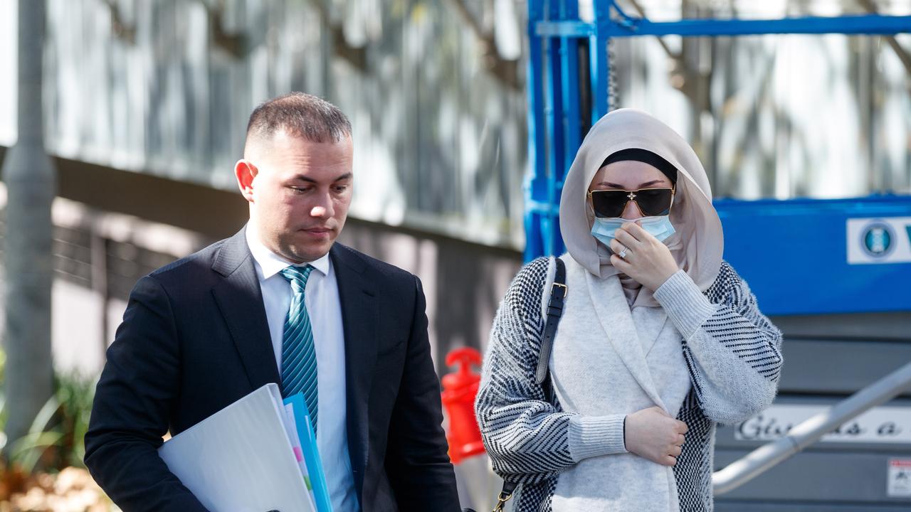 Lawyer Talal Krayem and the wife of Adam Abdallah, enter Bankstown Court on Monday. Picture: David Swift/NCA NewsWire