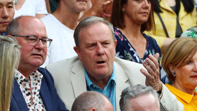 Peter Costello watches Novak Djokovic in action. Picture: Mark Stewart