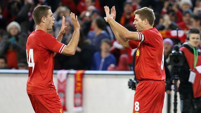 Melbourne Victory v Liverpool FC at the M.C.G., Liverpool's Steven Gerrard celebrates his goal in the first half with Jordan Henderson.