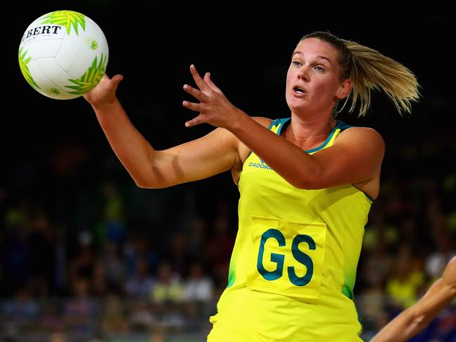 GOLD COAST, AUSTRALIA - APRIL 14:  Caitlin Thwaites of Australia catches the ball with Katrina Grant of New Zealand during Netball Semifinal match between Australia and New Zealand on day 10 of the Gold Coast 2018 Commonwealth Games at Coomera Indoor Sports Centre on April 14, 2018 on the Gold Coast, Australia.  (Photo by Dean Mouhtaropoulos/Getty Images)