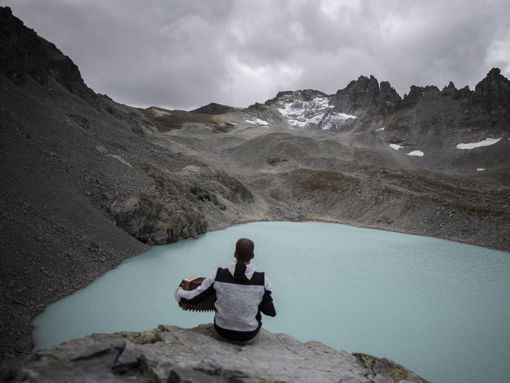 A hiker with a view of Wildlake and the Pizol glacier on the sideline of a commemoration for the “dying” glacier of Pizol mountain. Picture: AP