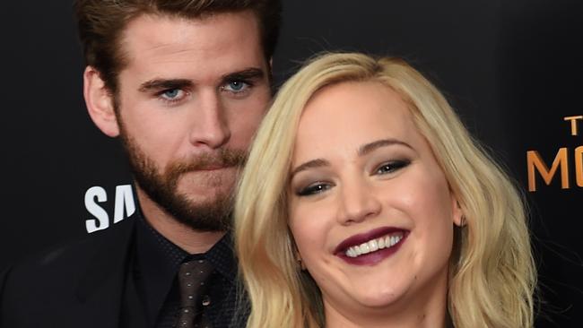 Jennifer Lawrence Porn Hunger Games - Jennifer Lawrence and Liam Hemsworth look very cosy on The Hunger Games red  carpet | news.com.au â€” Australia's leading news site