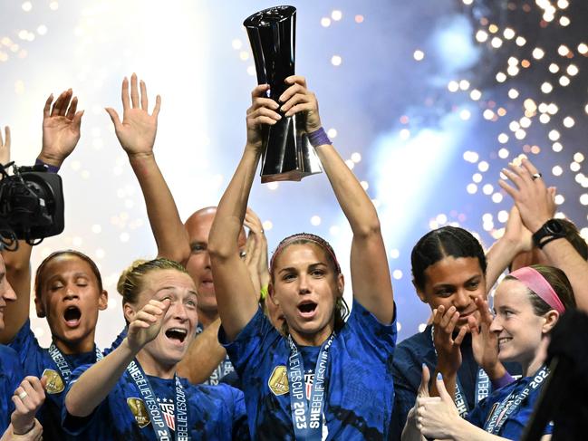 United States forward Alex Morgan (C) raises the SheBelieves Cup trophy. Picture: AFP