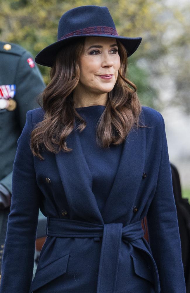 Queen Mary of Denmark stepped out solo and looked typically stylish in a navy wool trench and matching hat to attend an event in Copenhagen. Picture: Martin Sylvest Andersen/Getty Images