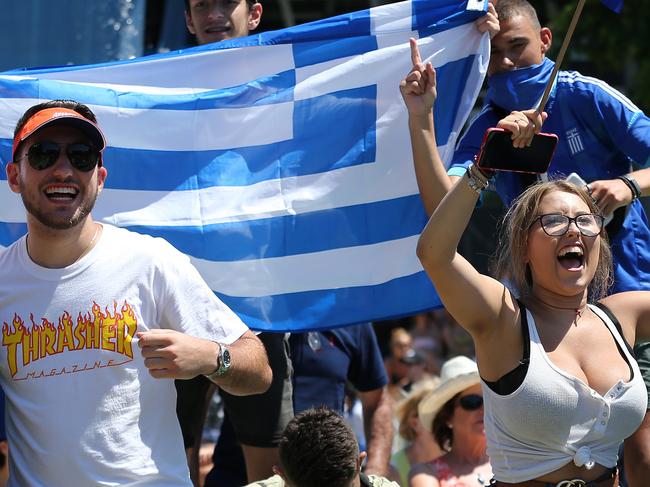 Tennis fans cheer on Stefanos Tsitsipas of Greece against Roberto Bautista Agut of Spain in the men's singles quarter final match on day nine of the Australian Open tennis tournament in Melbourne, Tuesday, January 22, 2019. (AAP Image/Erik Anderson) NO ARCHIVING, EDITORIAL USE ONLY