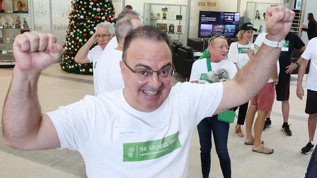 Arundel residents outside Gold Coast City Council Chambers celebrating after a special meeting of Councillors today voted to scrap Arundel golf club plans. Organiser Jason Young happy with the decision. Picture Glenn Hampson