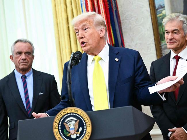 US President Donald Trump speaks about the Salvadoran migrant Kilmar Abrego Garcia, a US resident deported to his home country, during a swearing-In ceremony for Mehmet Oz (R) as the administrator of the Centers for Medicare and Medicaid Services in the Oval Office of the White House in Washington, DC on April 18, 2025. (Photo by Mandel NGAN / AFP)